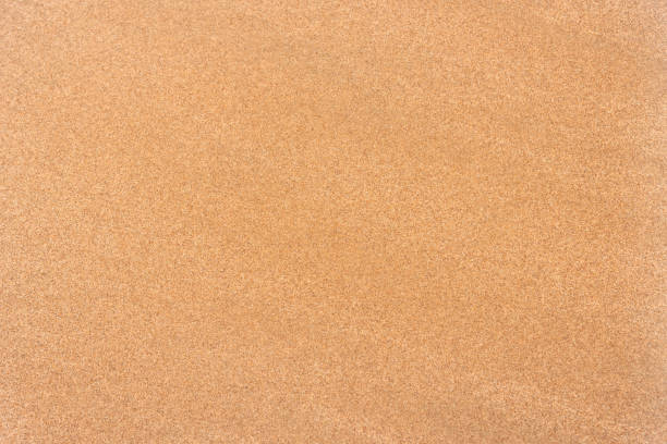 texture del motivo di sfondo della superficie di sabbia liscia - cork tops foto e immagini stock