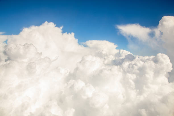 istock Clouds that are visible from the airplane window. Flight in the clouds or over the clouds 1007078794