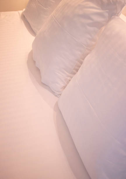 istock Modern minimalist luxury five star hotel bed cotton sheet and pillow case cover clean ready for guests. 1007080378