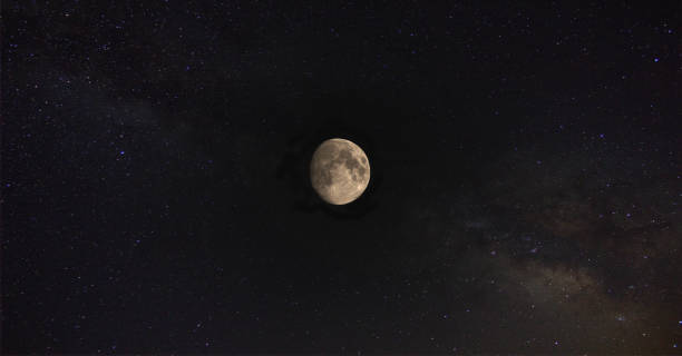 istock Moon close up shot with some stars around it. 1007080450