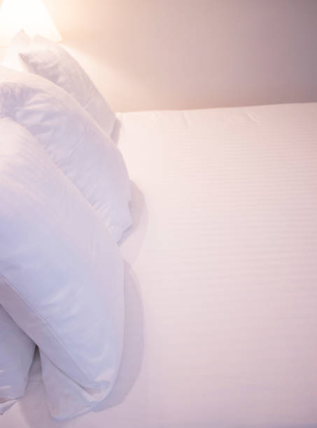istock Modern minimalist luxury five star hotel bed cotton sheet and pillow case cover clean ready for guests. 1007080476