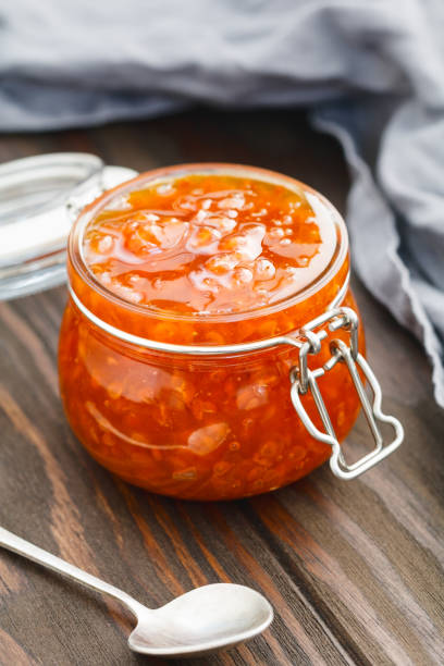 istock Glass jar with cloudberry jam. Nordic cuisine. 1007083818