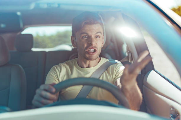 istock Emotional man feeling furious while driving near dangerous driver 1007084054