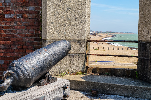 Eastbourne, UK - June 27 2018. Cannon protecting England's south coast, at the Eastbourne Redoubt,  a circular fortress that was built to protect Britain during the Napoleonic Wars in the early 19th century.
