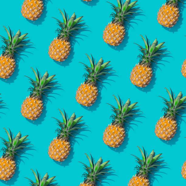istock Pineapple creative tropical pattern vivid blue background. Abstract summer art background. Minimal print concept. Flat lay food. 1007090758