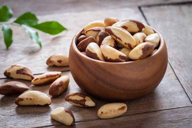 istock Brazil nuts in wooden bowl 1007091022