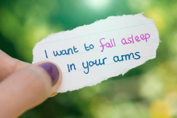 istock Passionate hand-written love note held in woman's hand 1007091314