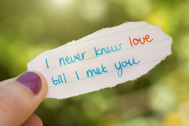 istock Passionate hand-written love note held in woman's hand 1007093680