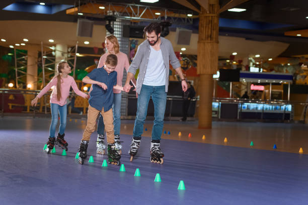 istock family spending time together on roller rink with cones 1007094414