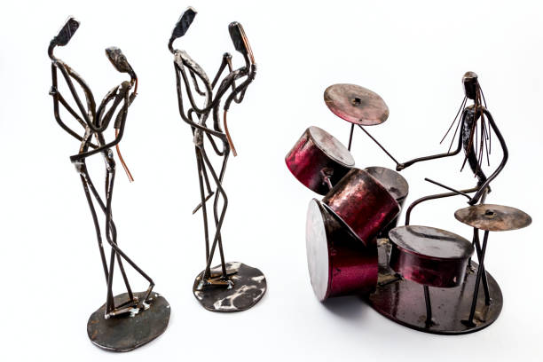 istock Creative figure of a musician, drummer is playing for two couples who are dancing tango, samba, rumba 1007101128