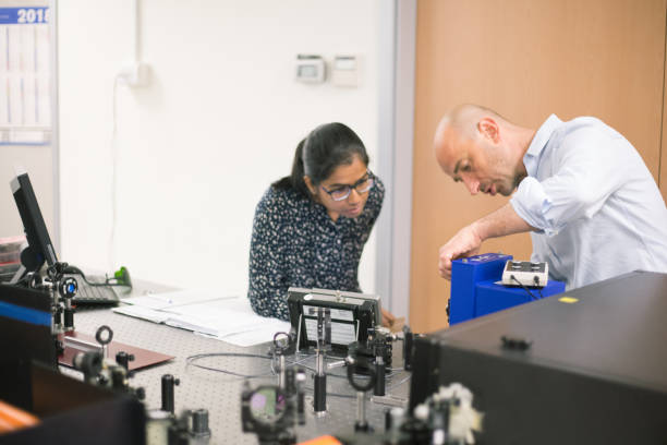 istock Professor Explaining to a Student How to Use Powerful High Frequency Laser for New Materials Research 1007106336