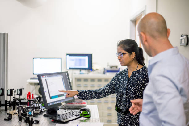 istock Young Woman and Man Analyzing Research Data on Computer Monitor 1007107150