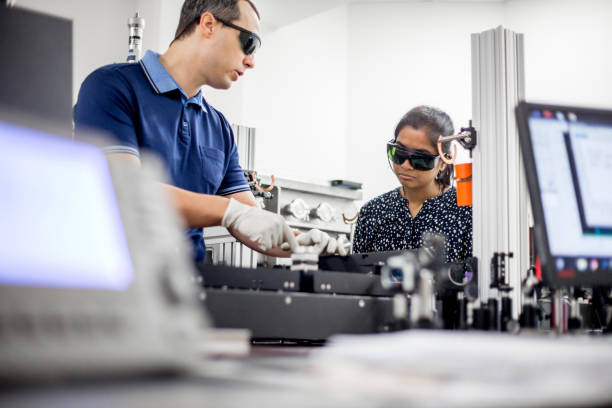 istock Multi-ethnic Group of Researchers Using High Frequency Laser for New Materials Research 1007107398