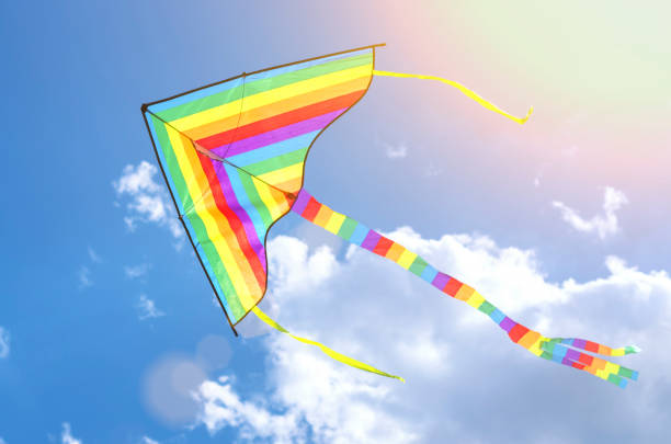 istock colorful flying kite flying in the sky with clouds 1007108554