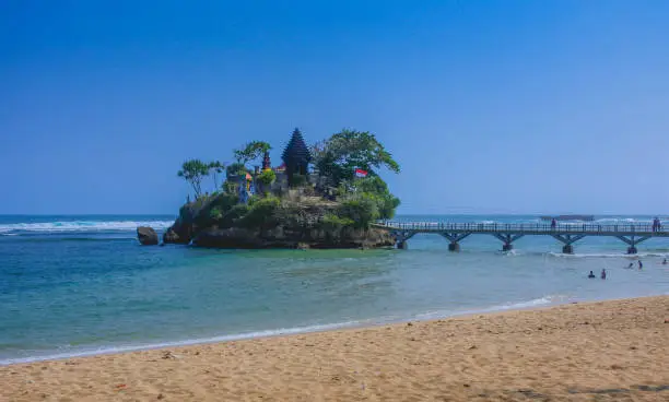 Balekambang beach in east java, with a hindu temple in small island