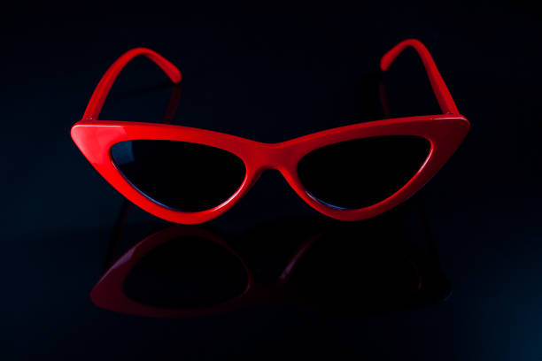 istock Red fashion sunglasses on a black background. 1007111170