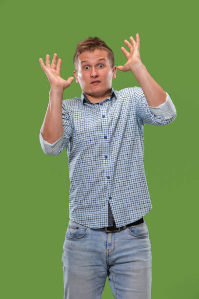 istock Portrait of the scared man on green 1007130184
