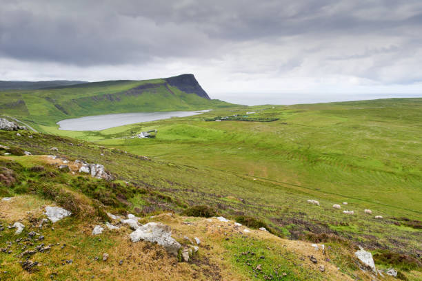 istock Green farm pastures, Loch Eishort and Ramasaig Cliff 1007130228