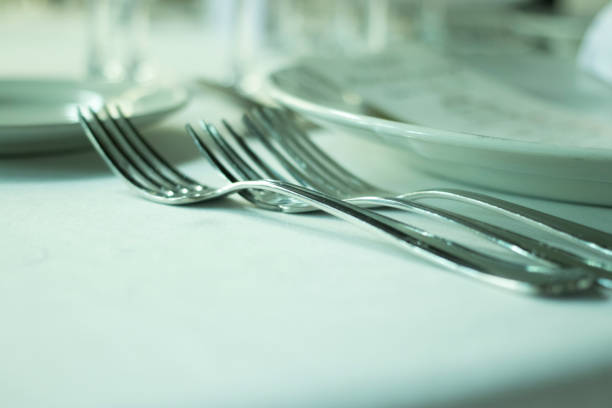 istock Wedding reception banquet dinner party table place settings set in luxury hotel venue. 1007141932