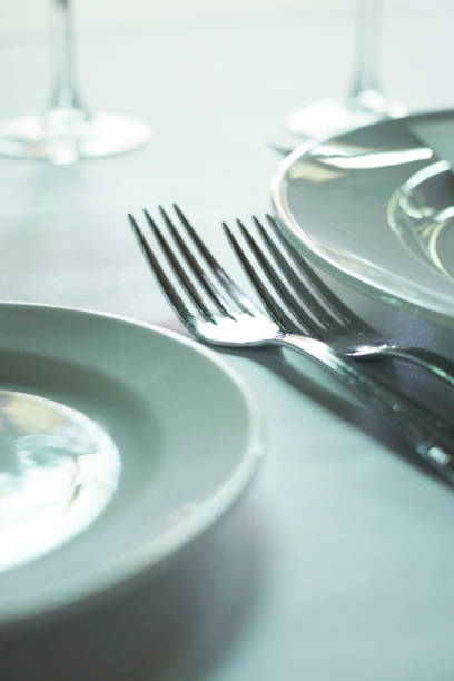 istock Wedding reception banquet dinner party table place settings set in luxury hotel venue. 1007143210
