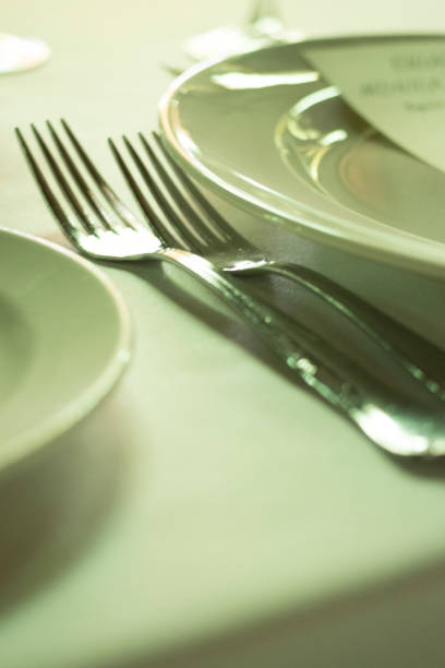 istock Wedding reception banquet dinner party table place settings set in luxury hotel venue. 1007143388