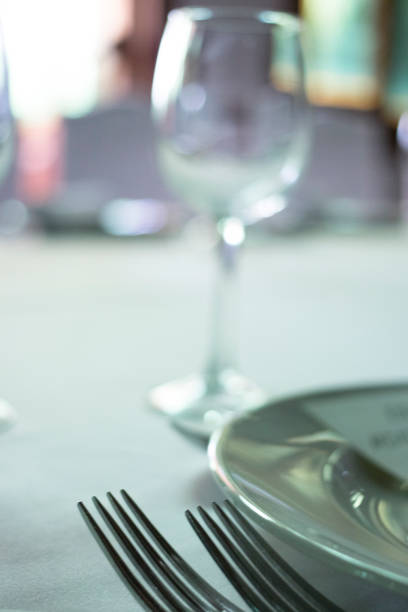 istock Wedding reception banquet dinner party table place settings set in luxury hotel venue. 1007143592