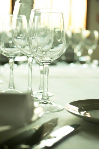 istock Wedding reception banquet dinner party table place settings set in luxury hotel venue. 1007144292