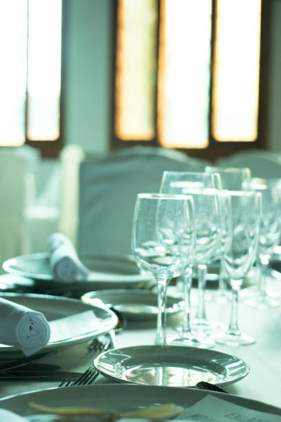 istock Wedding reception banquet dinner party table place settings set in luxury hotel venue. 1007144302