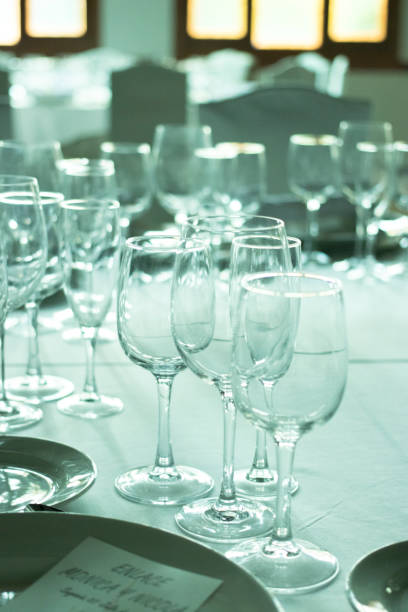 istock Wedding reception banquet dinner party table place settings set in luxury hotel venue. 1007144350