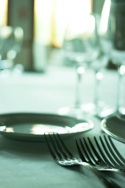 istock Wedding reception banquet dinner party table place settings set in luxury hotel venue. 1007144388