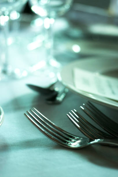 istock Wedding reception banquet dinner party table place settings set in luxury hotel venue. 1007144410