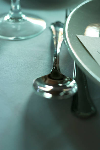 istock Wedding reception banquet dinner party table place settings set in luxury hotel venue. 1007144434