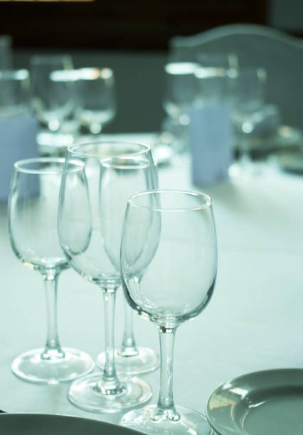 istock Wedding reception banquet dinner party table place settings set in luxury hotel venue. 1007144584