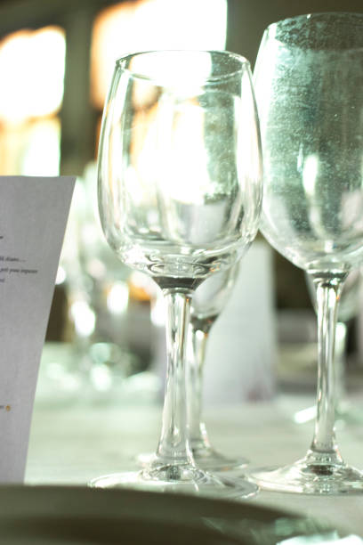 istock Wedding reception banquet dinner party table place settings set in luxury hotel venue. 1007144632