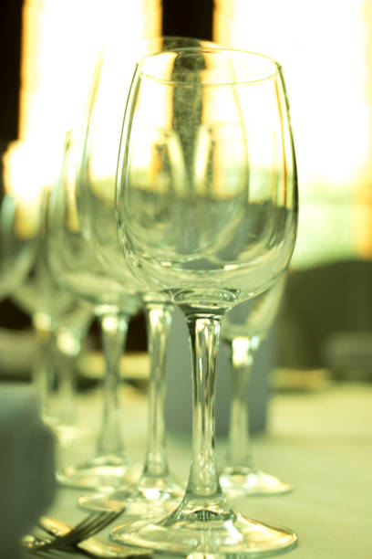 istock Wedding reception banquet dinner party table place settings set in luxury hotel venue. 1007144694