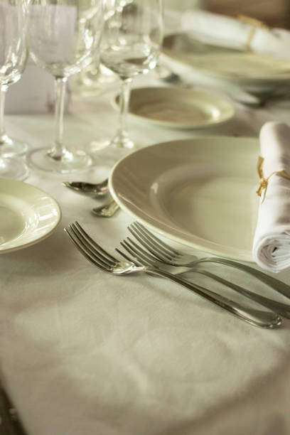 istock Wedding reception banquet dinner party table place settings set in luxury hotel venue. 1007144704