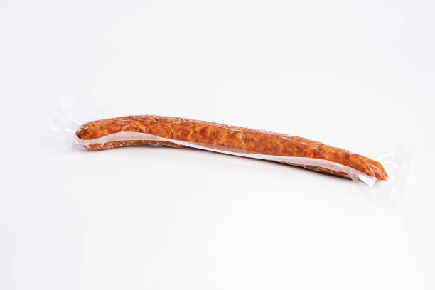 istock Smoked sausage in transparent plastic package 1007151582