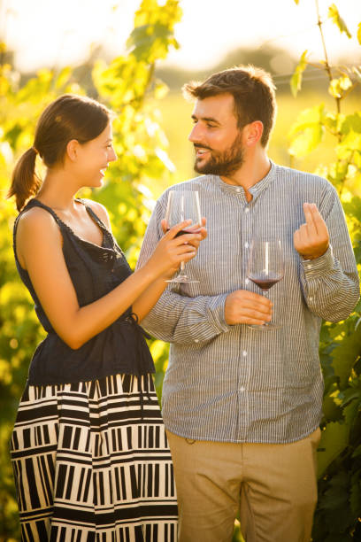 istock Romantic couple tasting wine in the vineyard 1007152538