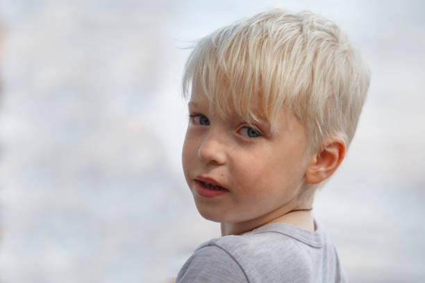istock Portrait of a blond boy on a white background. 1007152722