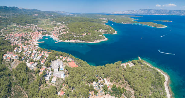 Jesla Harbor, Hvar, Croatia Unique aerial of the beautiful croatian harbor town Jesla with its famous St. Mary’s Church. Located on the Island Hvar in the Adriatic Sea. The Island Brac in back. Croatia. Converted from RAW. jelsa stock pictures, royalty-free photos & images