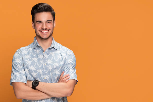 istock Fashionable young smiling man posing. 1007156734