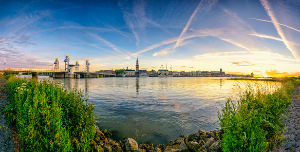 Panoramic view over the city of Kampen at the river IJssel in Overijssel, The Netherlands during a colorful sunset in summer.
