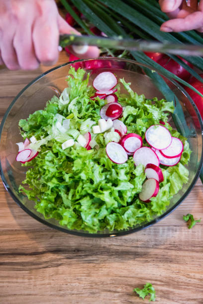istock fresh salad with radishes, lettuce and onions 1007164600