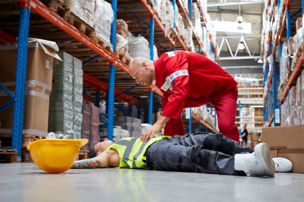 istock Dangerous accident during work. Paramedic gives first aid 1007165280