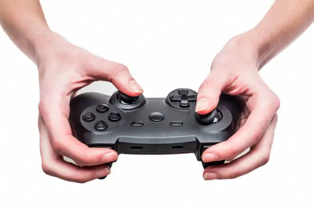 Photo of woman is playing on the gamepad