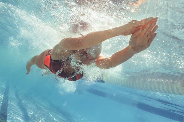 istock Professional swim athlete gliding in pool 1007171730