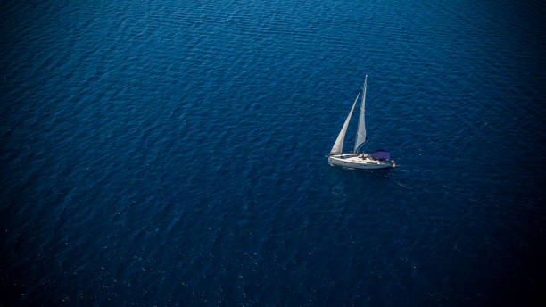 istock Sailing boat on open water, aerial view 1007172814