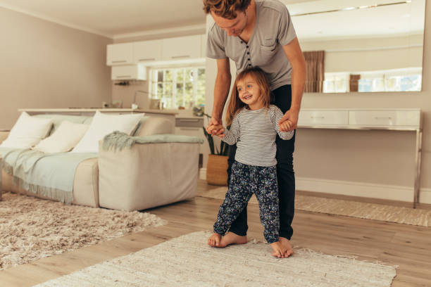 istock Father and daughter playing at home 1007175066