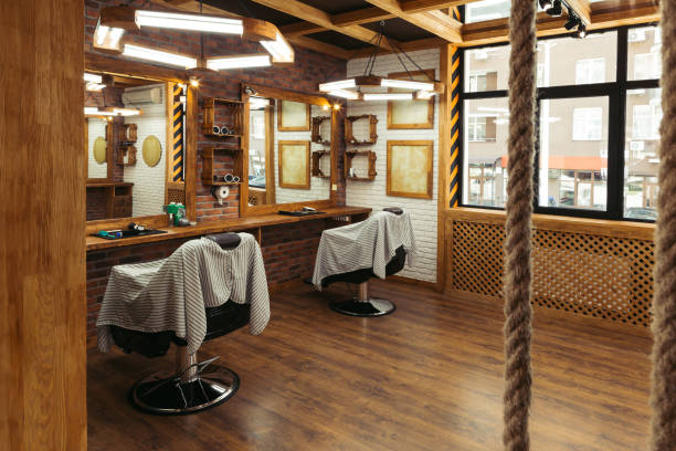 istock empty chairs and mirrors in modern barbershop interior 1007175496