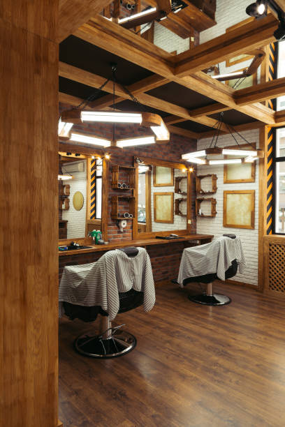istock empty chairs and mirrors in modern barbershop 1007175538